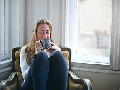 Woman enjoying a good cup of coffee