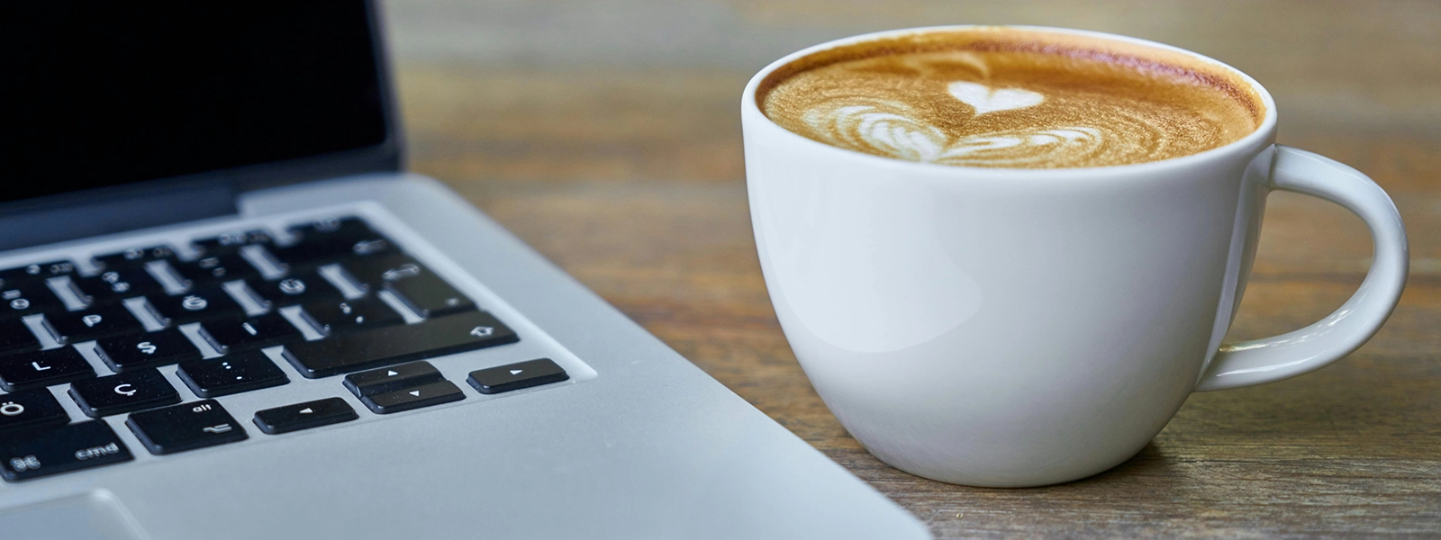 Latte next to a computer